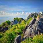 White pagodas in a sea of cloud atop Lampang mountain