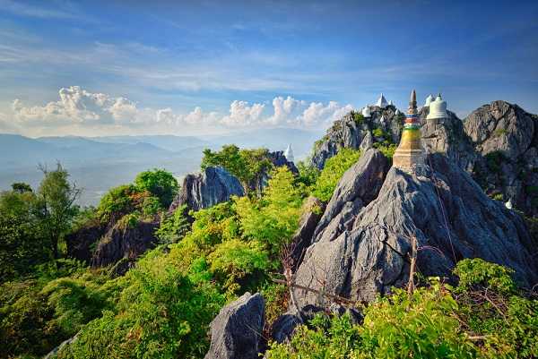 White pagodas in a sea of cloud atop Lampang mountain